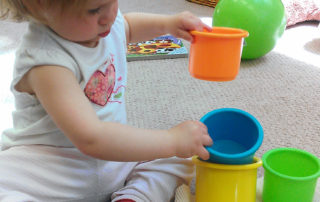 child sorting toys