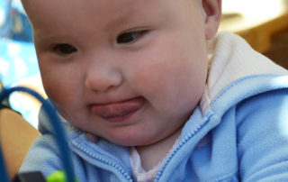 baby concentrating on puzzle