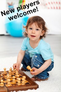 young boy playing chess
