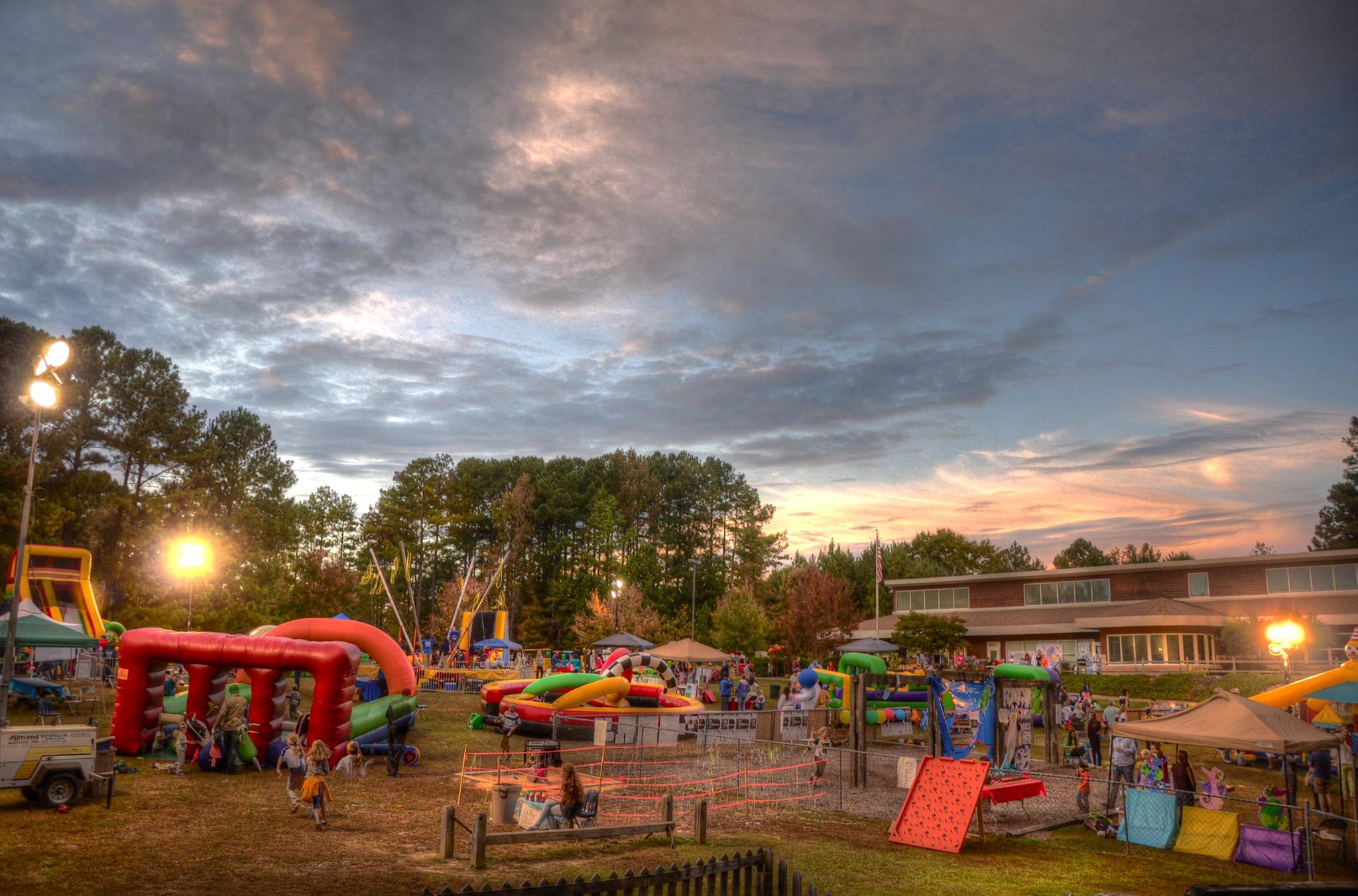 new school montessori center fall festival 2014 bouncy houses games children families