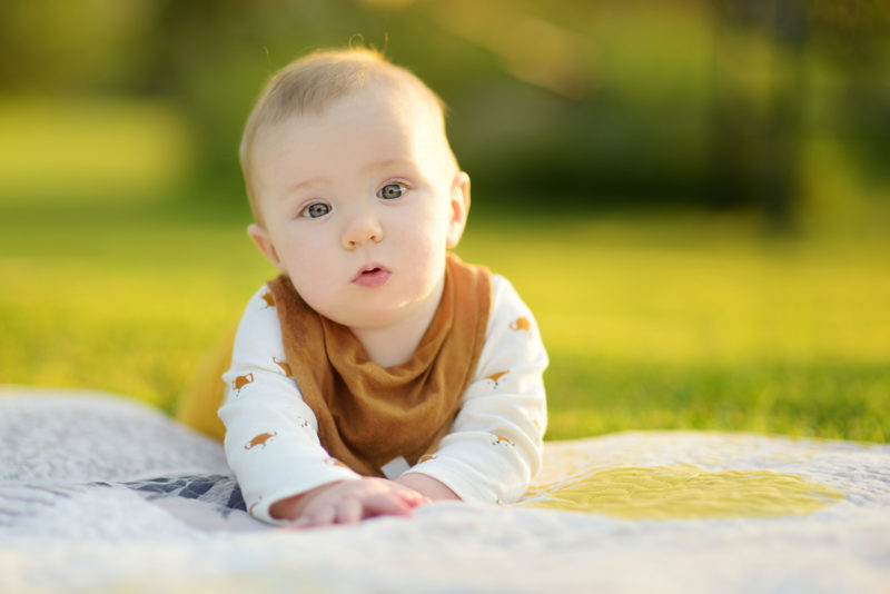 Baby crawling outdoors