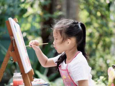 girl painting outdoors