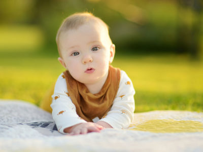 Baby crawling outdoors