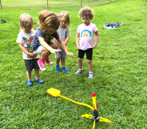 children jumping on a rocket