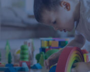 boy playing with Montessori Materials