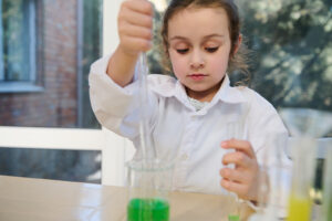 girl with chemicals for science camp