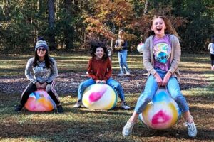 3 children enjoying bouncy balls