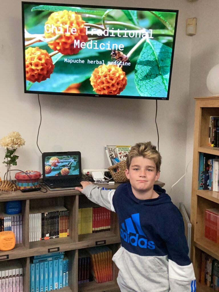 Middle school student presenting a powerpoint