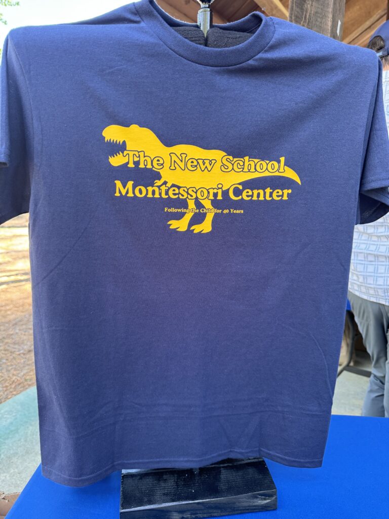 spring fling t-shirt 2024 t-shirt off The New School Monty the T-Rex mascot on the front