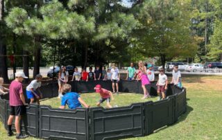 children playing in a gaga pit at The New School