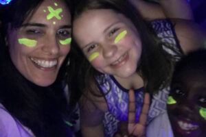 teacher and students with glow paint at The New School's student dance