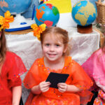 Three girls at The New School International Night Event dressed in Thai outfits