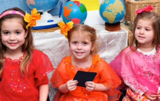 Three girls at The New School International Night Event dressed in Thai outfits