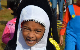 young African American boy dressed as a shark for halloween