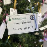 a tag on a Christmas tree for a charity