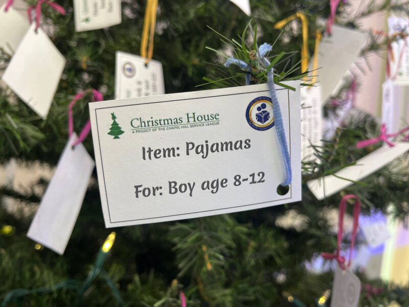 a tag on a Christmas tree for a charity