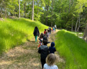Children walking on long trail at The New School