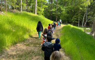 Children walking on long trail at The New School